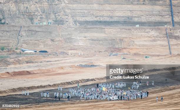 Environmental protesters enter the open-cast brown coal mining Hambach on November 5, 2017 near Kerpen, Germany. The protest, part of a string of...