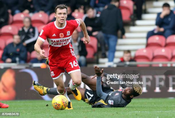 Didier N'Dong of Sunderland is floored by the challenge of Jonny Howson of Middlesbrough during the Sky Bet Championship match between Middlesbrough...