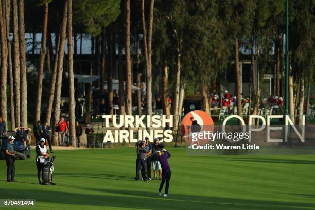 Justin Rose of England hits his second shot on the 18th hole during the final round of the Turkish Airlines Open at the Regnum Carya Golf & Spa...