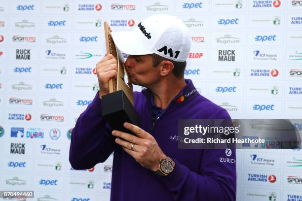 Justin Rose of England kisses the trophy after his victory during the final round of the Turkish Airlines Open at the Regnum Carya Golf & Spa Resort...