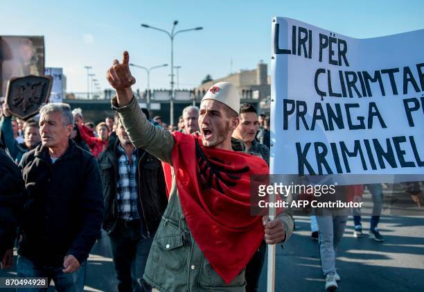 Macedonian Albanians gather in Skopje on November 5 to protest against the verdict of people convicted for plotting attacks and clashing with the...
