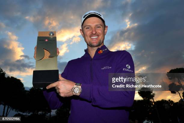 Justin Rose of England poses with the trophy after his victory during the final round of the Turkish Airlines Open at the Regnum Carya Golf & Spa...