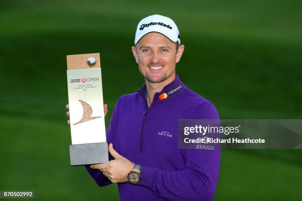 Justin Rose of England poses with the trophy after his victory during the final round of the Turkish Airlines Open at the Regnum Carya Golf & Spa...