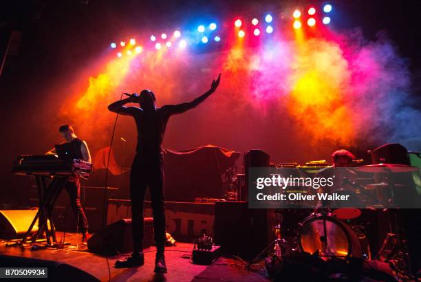 Andy Morin, Stefan Burnett, and Zach Hill of Death Grips perform at Hollywood Palladium on November 4, 2017 in Los Angeles, California.