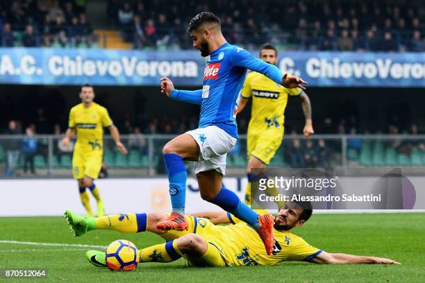 Lorenzo Insigne of SSC Napoli competes for the ball whit Nenad Tomovic AC Chievo Verona during the Serie A match between AC Chievo Verona and SSC...