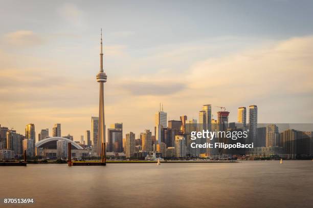 toronto skyline at sunset from toronto islands - toronto stock pictures, royalty-free photos & images