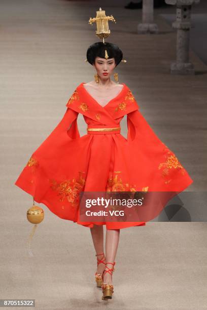 Model showcases designs on the runway at Heaven Gaia collection by designer Xiong Ying during the Mercedes-Benz China Fashion Week Spring/Summer 2018...