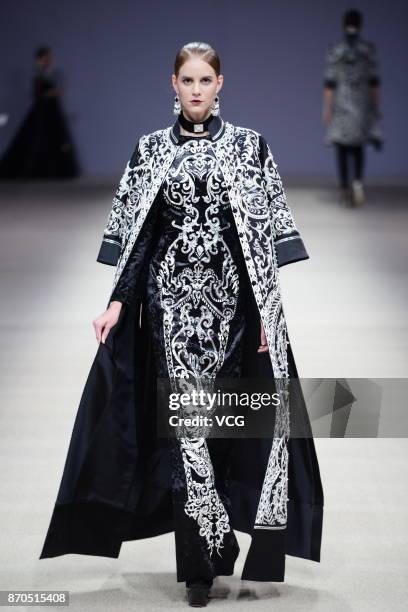 Model showcases designs on the runway at Heaven Gaia collection by designer Xiong Ying during the Mercedes-Benz China Fashion Week Spring/Summer 2018...