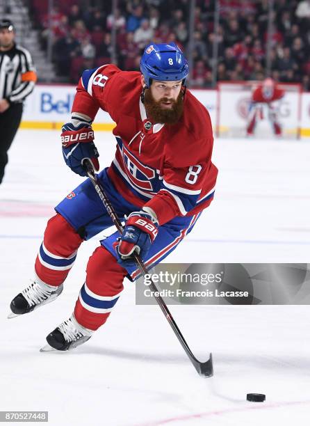Jordie Benn of the Montreal Canadiens looks to pass the puck against against the New York Rangers in the NHL game at the Bell Centre on October 28,...