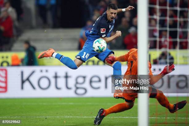 Sandro Wagner of Hoffenheim scores his team's third goal past goalkeeper Timo Horn of Koeln during the Bundesliga match between 1. FC Koeln and TSG...