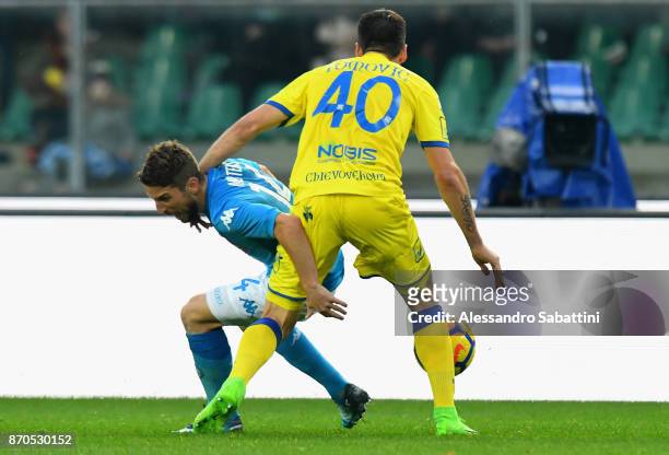 Dries Mertens of SSC Napoli competes for the ball whit Nenad Tomovic AC Chievo Verona during the Serie A match between AC Chievo Verona and SSC...