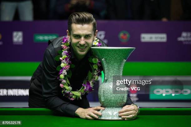 Mark Selby of England celebrates after winning the final match against Mark Allen of Northern Ireland on Day eight of the 2017 Snooker International...