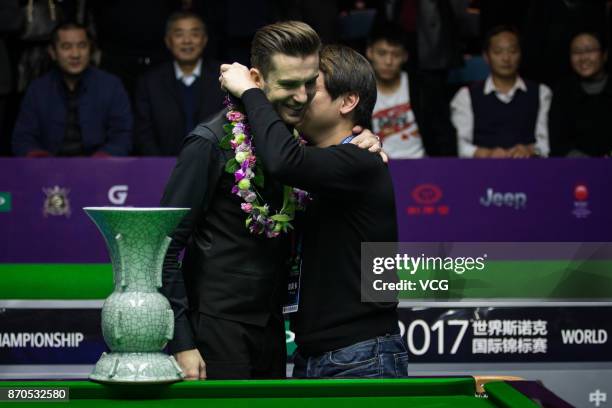 Mark Selby of England celebrates after winning the final match against Mark Allen of Northern Ireland on Day eight of the 2017 Snooker International...