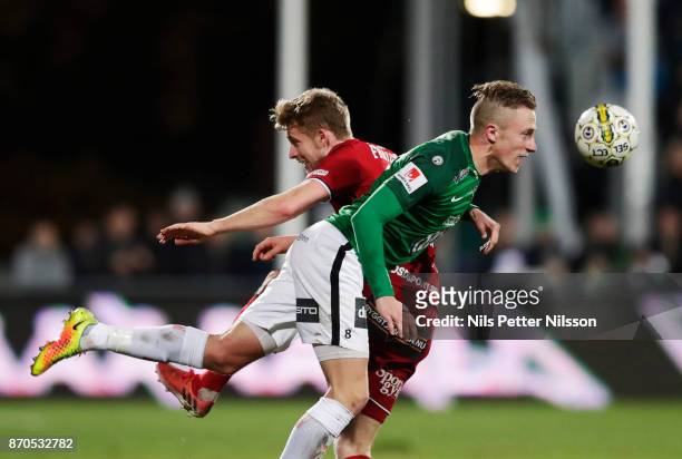 Ludvig Fritzon of Ostersunds FK and Joakim Karlsson of Jonkopings Sodra competes for the ball during the Allsvenskan match between Jonkopings Sodra...