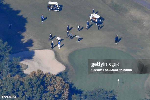 In this aerial image, U.S. President Donald Trump plays golf with Japanese Prime Minister Shinzo Abe and Hideki Matsuyama at Kasumigaseki Country...