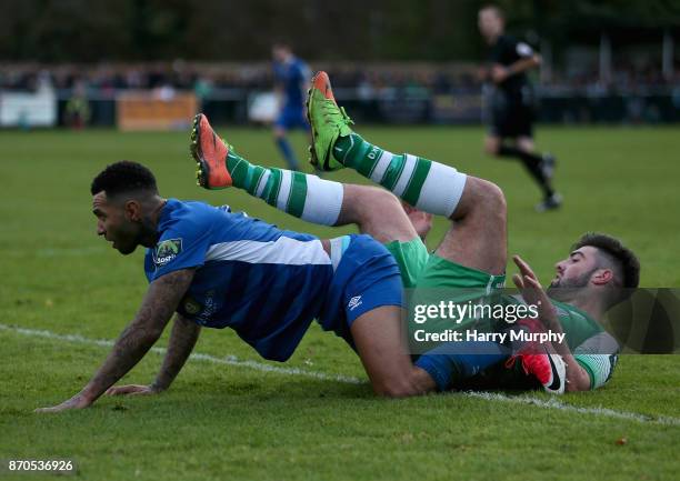 Jermaine Pennant of Billericay Town and Blake Davies of Leatherhead clash during The Emirates FA Cup First Round match between Leatherhead and...