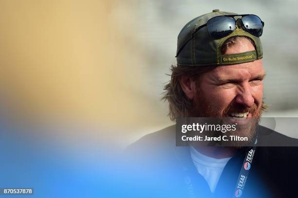 Fixer Upper' star and honorary pace car driver Chip Gaines looks on prior to the Monster Energy NASCAR Cup Series AAA Texas 500 pace car at Texas...