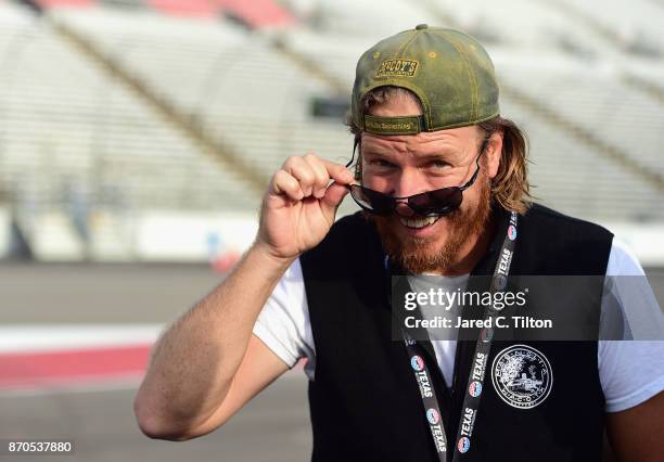 Fixer Upper' star and honorary pace car driver Chip Gaines looks on prior to the Monster Energy NASCAR Cup Series AAA Texas 500 pace car at Texas...