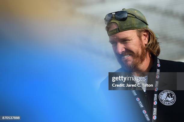 Fixer Upper' star and honorary pace car driver Chip Gaines looks on prior to the Monster Energy NASCAR Cup Series AAA Texas 500 pace car at Texas...