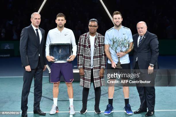 Winner USA's Jack Sock poses with the trophy next to second placed Serbia's Filip Krajinovic , Paris Masters director Guy Forget , French judoka...