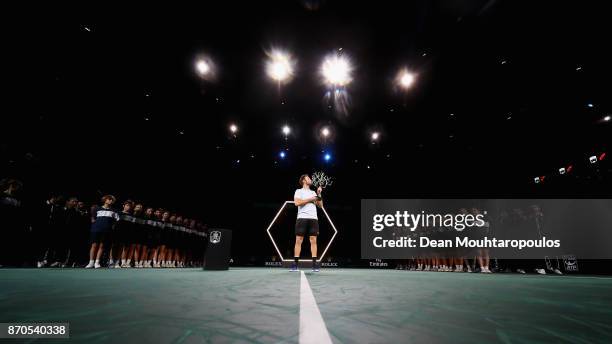 Jack Sock of the USA celebrates with the trophy after victory against Filip Krajinovic of Serbia in the Mens Final on day 7 of the Rolex Paris...