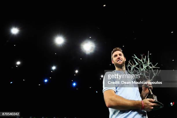 Jack Sock of the USA celebrates with the trophy after victory against Filip Krajinovic of Serbia in the Mens Final on day 7 of the Rolex Paris...