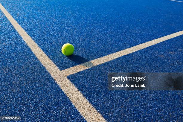 tennis  ball and service line - sky blue ball stock pictures, royalty-free photos & images