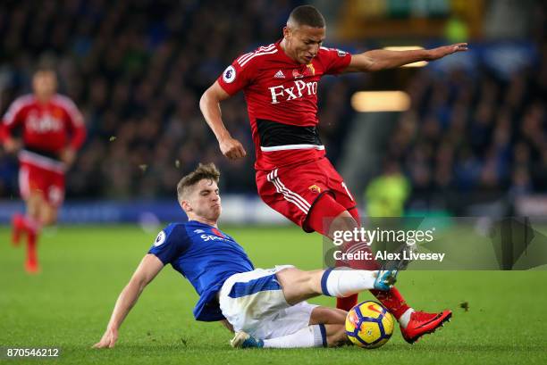 Jonjoe Kenny of Everton tackles Richarlison de Andrade of Watford during the Premier League match between Everton and Watford at Goodison Park on...