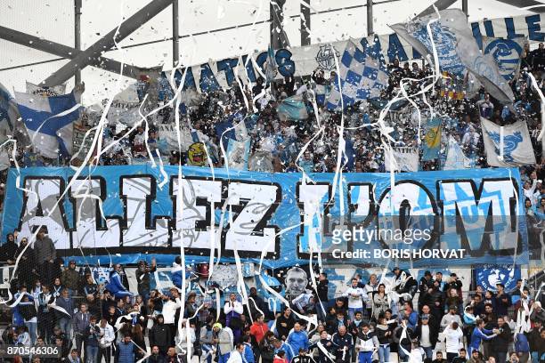 Olympique de Marseille fans hold a banner prior to the start of the French L1 football match between Olympique de Marseille and Caen at the Velodrome...