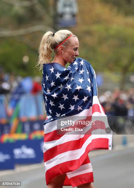 Shalane Flanagan of the United States celebrates winning the Professional Women's Division during the 2017 TCS New York City Marathon in Central Park...