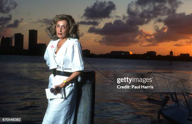 Edna Buchanan, worked as a journalist at the Miami Herald. Best known for her crime mystery novels stands near a waterway September 10 Miami, Florida