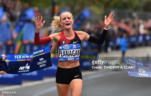 Shalane Flanagan of the US celebrates after crossing the finish line to win the Women's Division during the 2017 TCS New York City Marathon in New...