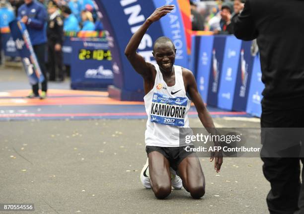 Geoffrey Kamworor of Kenya reacts after crossing the finish line to win the Men's Division during the 2017 TCS New York City Marathon in New York on...