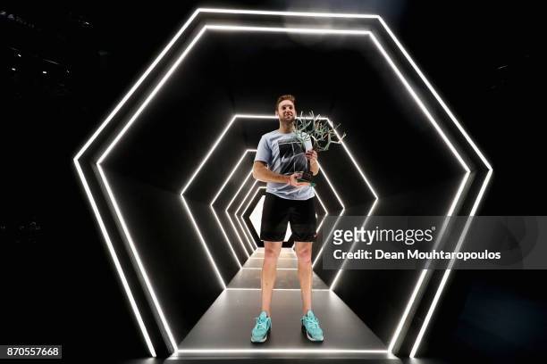 Jack Sock of the USA poses with the trophy in the players tunnel after victory against Filip Krajinovic of Serbia in the Mens Final on day 7 of the...