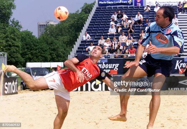 French international Eric Cantona shows his skills next to Swiss player Carmelo Rivolta in the match between France and Switzerland in the the...