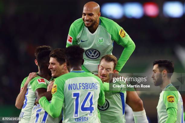 Mario Gomez of Wolfsburg celebrates his team's second goal with team mates during the Bundesliga match between VfL Wolfsburg and Hertha BSC at...