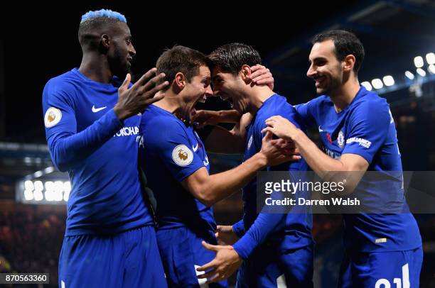 Alvaro Morata of Chelsea celebrates scoring his sides first goal with his Chelsea team mates during the Premier League match between Chelsea and...