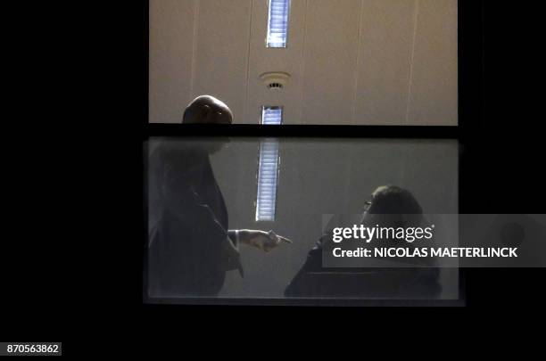 Man believed to be Carles Puigdemont sits inside the public prosecutor's office in Brussels, on November 5, 2017. Catalonia's sacked separatist...