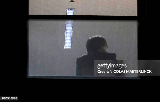Man believed to be Carles Puigdemont sits inside the public prosecutor's office in Brussels, on November 5, 2017. Catalonia's sacked separatist...