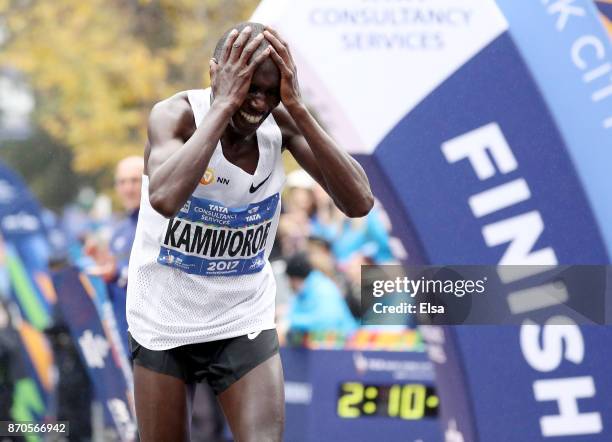 Geoffrey Kamworor of Kenya crosses the finish line as he wins the Professional Men's Division during the 2017 TCS New York City Marathon in Central...