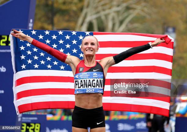 Shalane Flanagan of the United States celebrates winning the Professional Women's Division during the 2017 TCS New York City Marathon in Central Park...