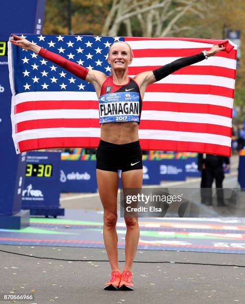 Shalane Flanagan of the United States celebrates winning the Professional Women's Division during the 2017 TCS New York City Marathon in Central Park...