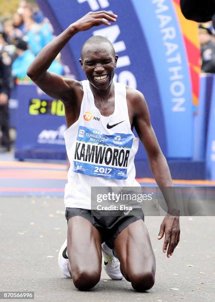 Geoffrey Kamworor of Kenya crosses the finish line as he wins the Professional Men's Division during the 2017 TCS New York City Marathon in Central...