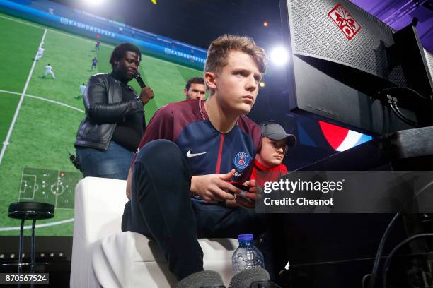 French player E-Sports, Lucas Cuillerier, gamertag 'DaXe' of the eSports team of Paris Saint-Germain competes in the final of the video game 'FIFA...