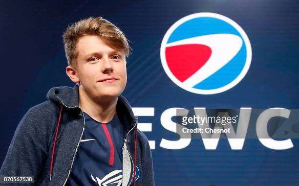 French E-Sports player Lucas Cuillerier, gamertag 'DaXe' of the Paris Saint-Germain eSports team poses after his victory in the final of the video...