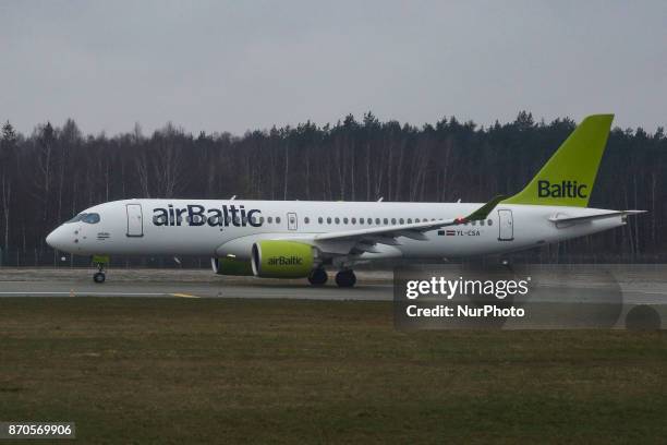 Air Baltic fleet during a rainy day in Riga international airport, Latvia on 5 November 2017. AirBaltic is a state owned low cost carrier. The...