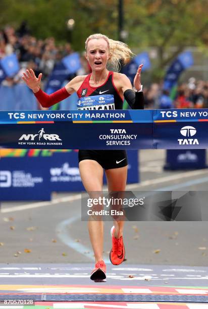 Shalane Flanagan of the United States celebrates winning the Professional Women's Division during the 2017 TCS New York City Marathon in Central Park...