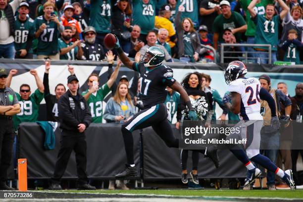 Wide receiver Alshon Jeffery of the Philadelphia Eagles runs in a touchdown against free safety Darian Stewart of the Denver Broncos during the first...