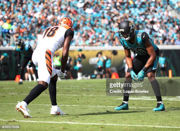 Green of the Cincinnati Bengals and Jalen Ramsey of the Jacksonville Jaguars wait for a play in the first half of their game at EverBank Field on...