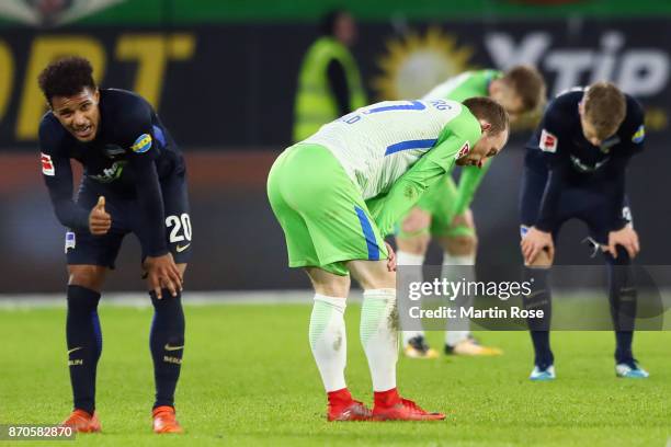 Maximilian Arnold of Wolfsburg and Valentino Lazaro of Berlin react after the Bundesliga match between VfL Wolfsburg and Hertha BSC at Volkswagen...